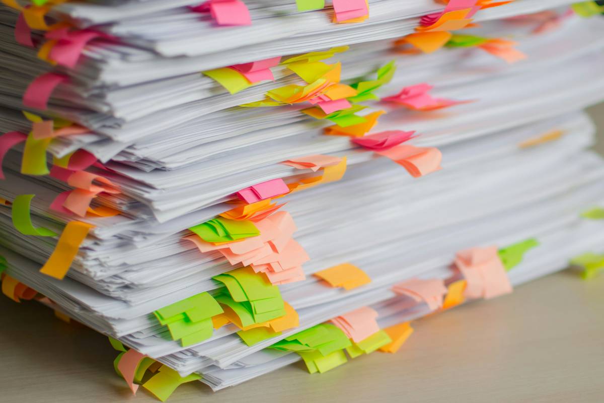 Telecom engineer reviewing Service Level Agreements (SLAs) during service interruption crisis